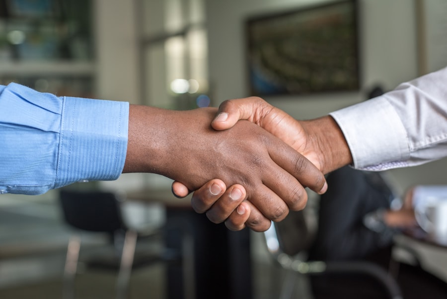 Business partnership agreement handshake